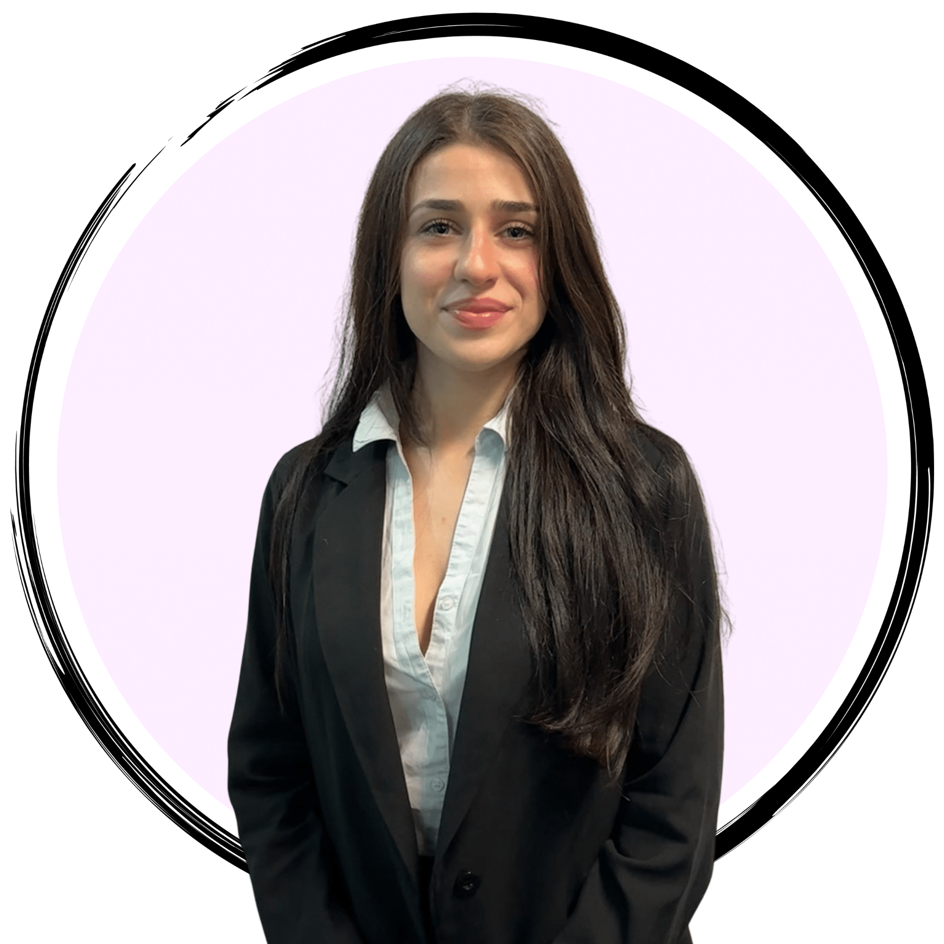 A young woman with long, dark hair is standing against a light pink circular background. She is wearing a light blue shirt under a black blazer and is smiling at the camera.